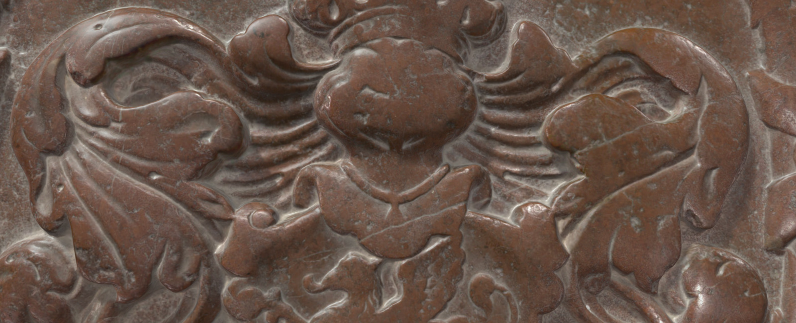 Steinrelief eines Wappenadlers mit ausgebreiteten Flügeln und einem zentralen Schild.