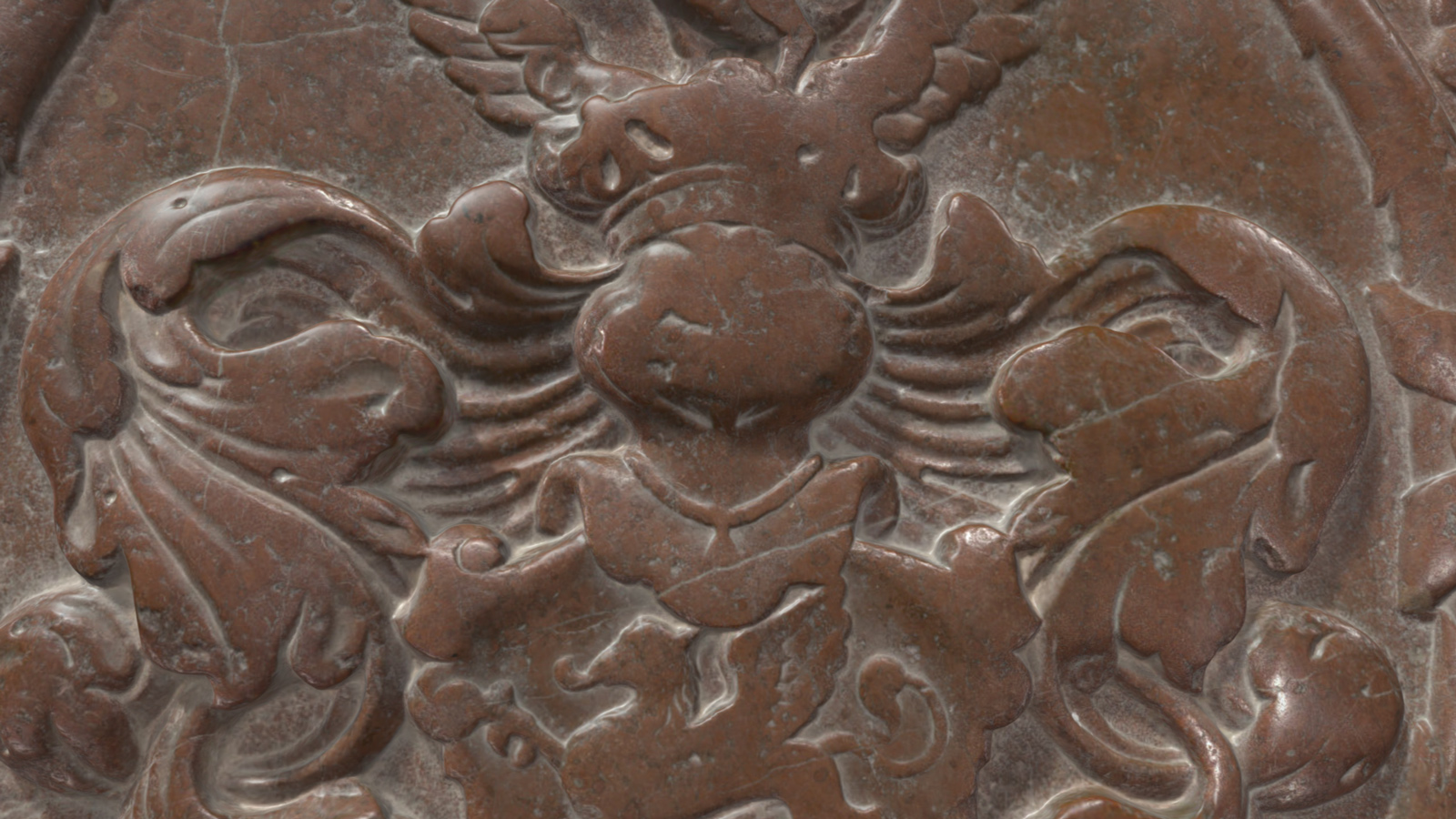 Steinrelief eines Wappenadlers mit ausgebreiteten Flügeln und einem zentralen Schild.